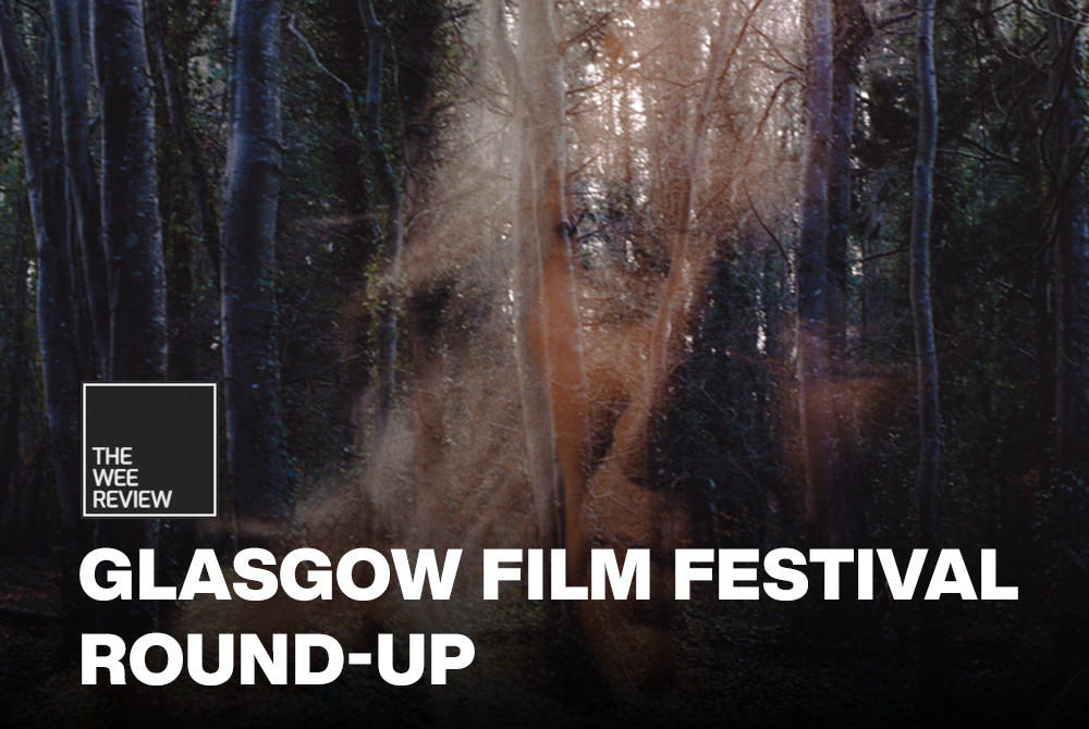 Glassgow film festival round up written on the bottom of the poster and The Wee Review logo on top of that. The background is an overlay of the actress Olwen Fouéré playing Rita Concannon over a landscape of a forest.